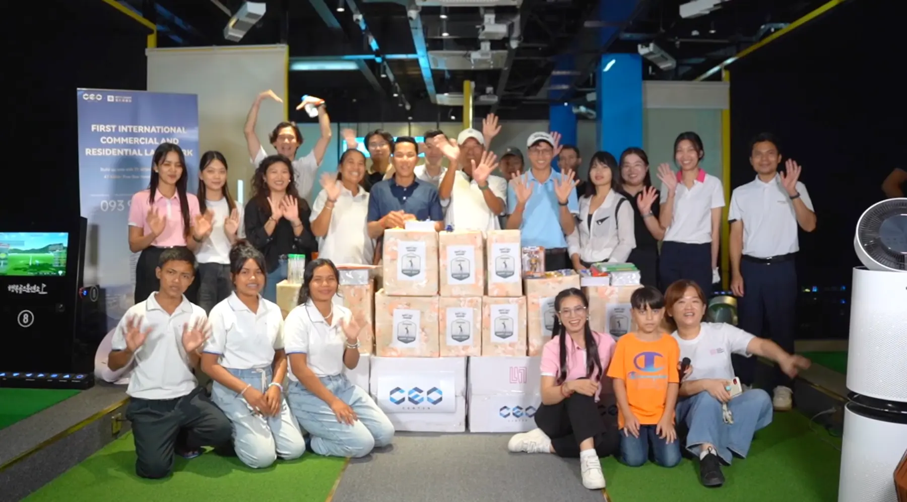 LIXIN Group indoor golf client event with participants, sponsored gifts and brand display